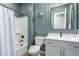 Bathroom featuring a shower-tub combo and a vanity sink with framed mirror at 2560 E Thornton Ct, Gilbert, AZ 85297