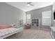 Cozy bedroom with neutral tones, plush carpeting, and ample natural light at 2560 E Thornton Ct, Gilbert, AZ 85297