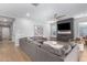 Inviting living room featuring modern decor, fireplace, and natural light, creating a comfortable and stylish atmosphere at 2560 E Thornton Ct, Gilbert, AZ 85297