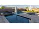 Sparkling pool and spa with sun loungers on the travertine patio at 2560 E Thornton Ct, Gilbert, AZ 85297