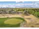 Aerial view of house on golf course with mountain views at 27831 N Makena Pl, Peoria, AZ 85383