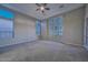 Bright bedroom with carpeted floor and large windows at 27831 N Makena Pl, Peoria, AZ 85383