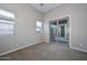 Bedroom with sliding glass door leading to a patio at 27831 N Makena Pl, Peoria, AZ 85383