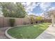 Artificial turf lawn, mature trees, and a curved gravel border at 2803 E Cobalt St, Chandler, AZ 85225