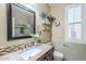 Well-appointed bathroom with granite countertop and large mirror at 2803 E Cobalt St, Chandler, AZ 85225