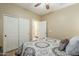 Spacious bedroom with double door closet and ensuite bathroom access at 2803 E Cobalt St, Chandler, AZ 85225