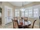 Bright dining area with a wooden table and four chairs at 2803 E Cobalt St, Chandler, AZ 85225