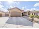 Tan house with brown garage door and a long driveway at 2803 E Cobalt St, Chandler, AZ 85225