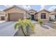 Tan house with brown garage door, landscaping, and a walkway at 2803 E Cobalt St, Chandler, AZ 85225