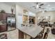 Open kitchen with large island, granite counters, and stainless steel appliances at 2803 E Cobalt St, Chandler, AZ 85225