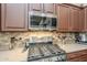 Stainless steel range and microwave in this well-equipped kitchen at 2803 E Cobalt St, Chandler, AZ 85225