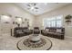 Spacious living room with brown couches and a round ottoman at 2803 E Cobalt St, Chandler, AZ 85225