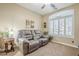 Relaxing sitting room featuring a comfortable recliner and large window at 2803 E Cobalt St, Chandler, AZ 85225