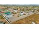 Aerial view showing a house, pool, detached garage, and surrounding desert landscape at 2809 W Paso Nuevo Dr, Phoenix, AZ 85086