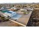 Aerial view of a house with a pool, detached garage, and solar panels at 2809 W Paso Nuevo Dr, Phoenix, AZ 85086