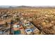 Aerial view of house, pool, detached garage, and surrounding desert landscape at 2809 W Paso Nuevo Dr, Phoenix, AZ 85086