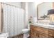 Clean bathroom with shower/tub combo and wood vanity at 2809 W Paso Nuevo Dr, Phoenix, AZ 85086