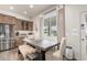 Kitchen dining area with wooden table and bench seating at 2809 W Paso Nuevo Dr, Phoenix, AZ 85086