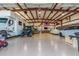 Spacious garage with multiple vehicles and a workshop area at 2809 W Paso Nuevo Dr, Phoenix, AZ 85086