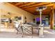 Covered patio with seating area and a mounted TV at 2809 W Paso Nuevo Dr, Phoenix, AZ 85086