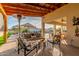 Outdoor patio furniture under covered pergola with pool view at 2809 W Paso Nuevo Dr, Phoenix, AZ 85086