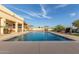 Large rectangular pool with a stone border and surrounding patio at 2809 W Paso Nuevo Dr, Phoenix, AZ 85086