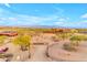 Aerial view of a ranch with a main house, barn, riding arena, and surrounding desert landscape at 32905 N 140Th St, Scottsdale, AZ 85262