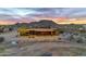 Stunning aerial view of a Southwestern-style home with a mountain backdrop at 32905 N 140Th St, Scottsdale, AZ 85262