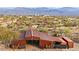 Large metal barn with double doors and adjacent storage containers at 32905 N 140Th St, Scottsdale, AZ 85262