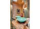 Bathroom with rustic wood vanity and teal vessel sinks at 32905 N 140Th St, Scottsdale, AZ 85262