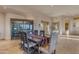 Bright dining area with large windows and a display cabinet at 32905 N 140Th St, Scottsdale, AZ 85262