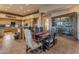 Rustic dining area with wooden table and chairs, adjacent to kitchen at 32905 N 140Th St, Scottsdale, AZ 85262