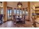 Charming dining area with a copper table and scenic views at 32905 N 140Th St, Scottsdale, AZ 85262