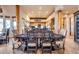 Rustic dining area adjacent to kitchen with wooden table and chairs at 32905 N 140Th St, Scottsdale, AZ 85262