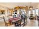 Rustic dining room with a wooden table and chandelier at 32905 N 140Th St, Scottsdale, AZ 85262