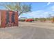 Entrance to the property, featuring a western-themed gate and a classic red truck at 32905 N 140Th St, Scottsdale, AZ 85262