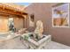 Courtyard entry with a wooden door, brick flooring, and a stone fountain at 32905 N 140Th St, Scottsdale, AZ 85262