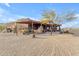 Single story home with covered patio and desert landscaping at 32905 N 140Th St, Scottsdale, AZ 85262