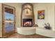 Fireplace with access to the patio and artwork at 32905 N 140Th St, Scottsdale, AZ 85262