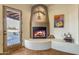 Fireplace with a rustic design and built-in seating at 32905 N 140Th St, Scottsdale, AZ 85262