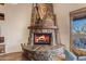 Impressive stone fireplace as a focal point of the room at 32905 N 140Th St, Scottsdale, AZ 85262