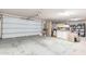 Spacious garage with overhead storage and ample room for vehicles and equipment at 32905 N 140Th St, Scottsdale, AZ 85262