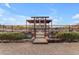 Raised garden beds with a rustic gate entrance at 32905 N 140Th St, Scottsdale, AZ 85262