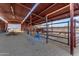 Multiple horse stalls with covered area and picnic tables at 32905 N 140Th St, Scottsdale, AZ 85262