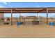 View of individual horse stables with covered areas at 32905 N 140Th St, Scottsdale, AZ 85262