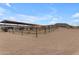 Several covered horse stables with metal fencing at 32905 N 140Th St, Scottsdale, AZ 85262