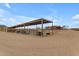 Multiple covered horse stables with metal fencing at 32905 N 140Th St, Scottsdale, AZ 85262