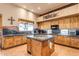 Kitchen features wood cabinets, granite counters, and a center island at 32905 N 140Th St, Scottsdale, AZ 85262