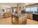 Island kitchen with wood cabinets, granite counters, & a view at 32905 N 140Th St, Scottsdale, AZ 85262