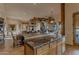 Rustic kitchen with granite countertops and wood cabinets at 32905 N 140Th St, Scottsdale, AZ 85262